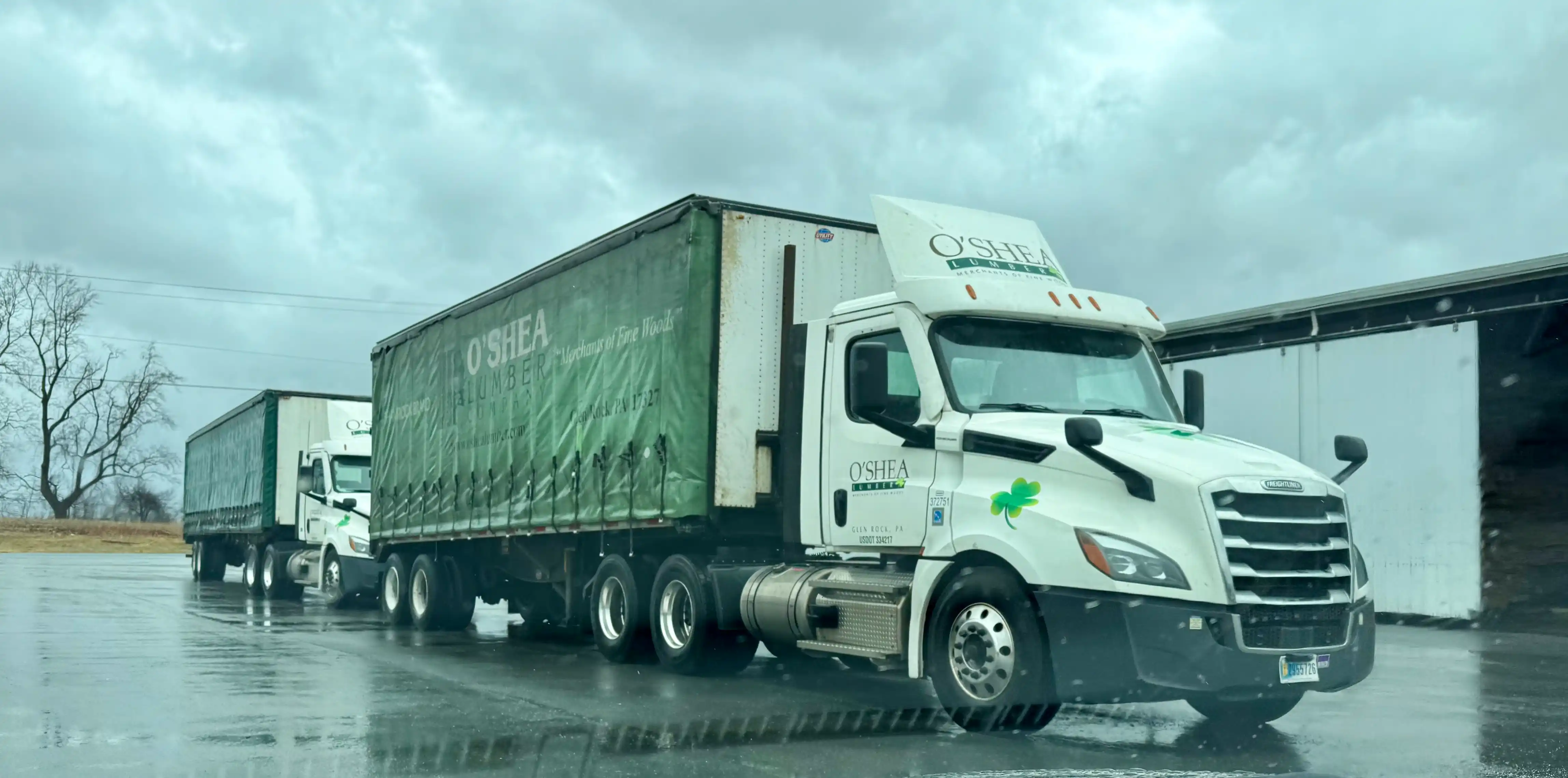 O'Shea Lumber trucks in the yard