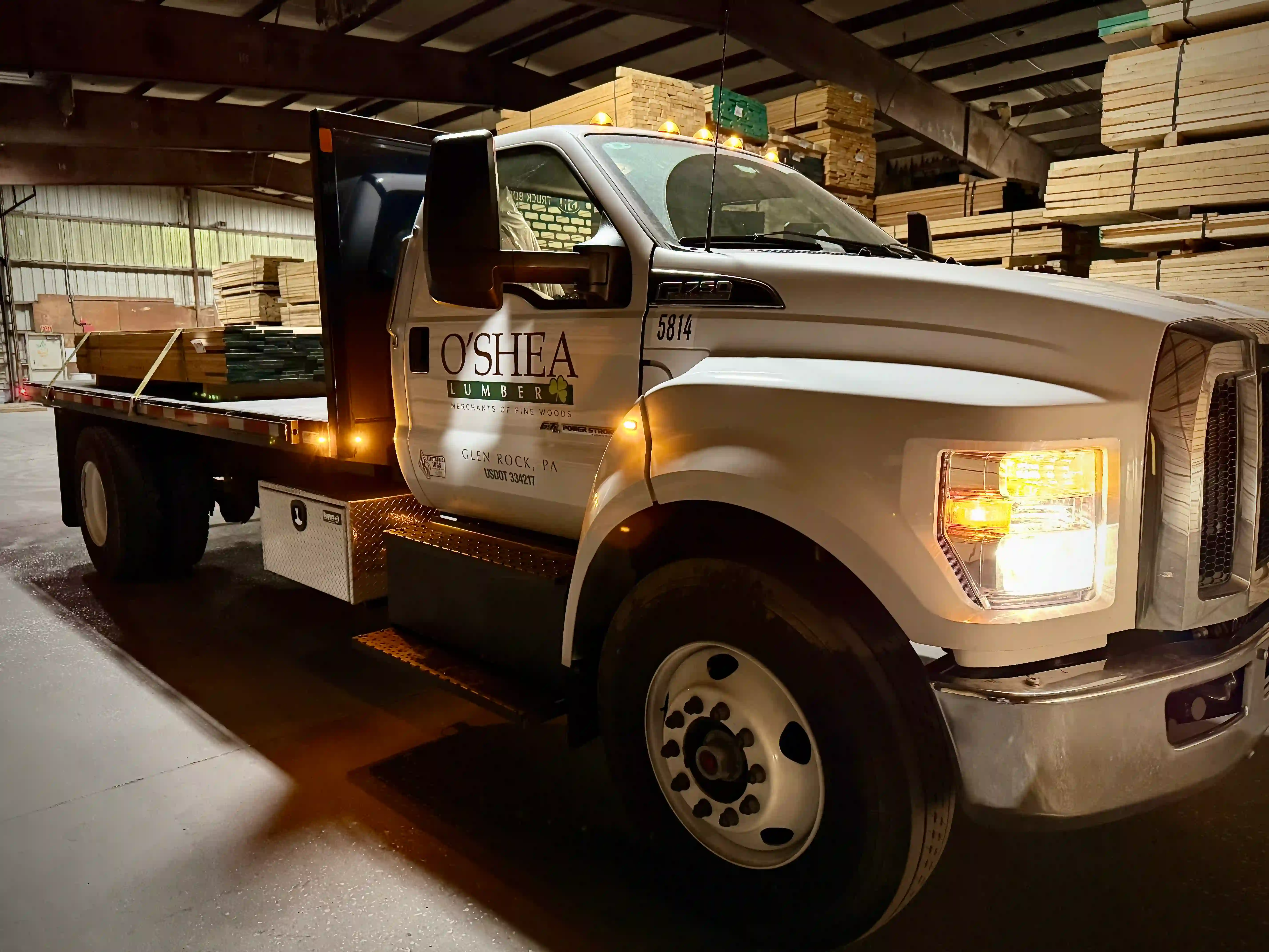 O'Shea Lumber flatbed truck loaded with hardwood